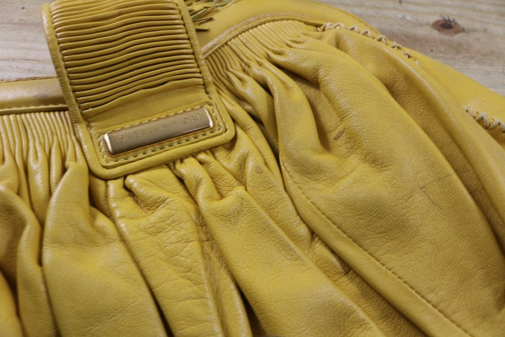 Isabella Fiore Large Yellow Leather Whipstitch Tassel Hobo