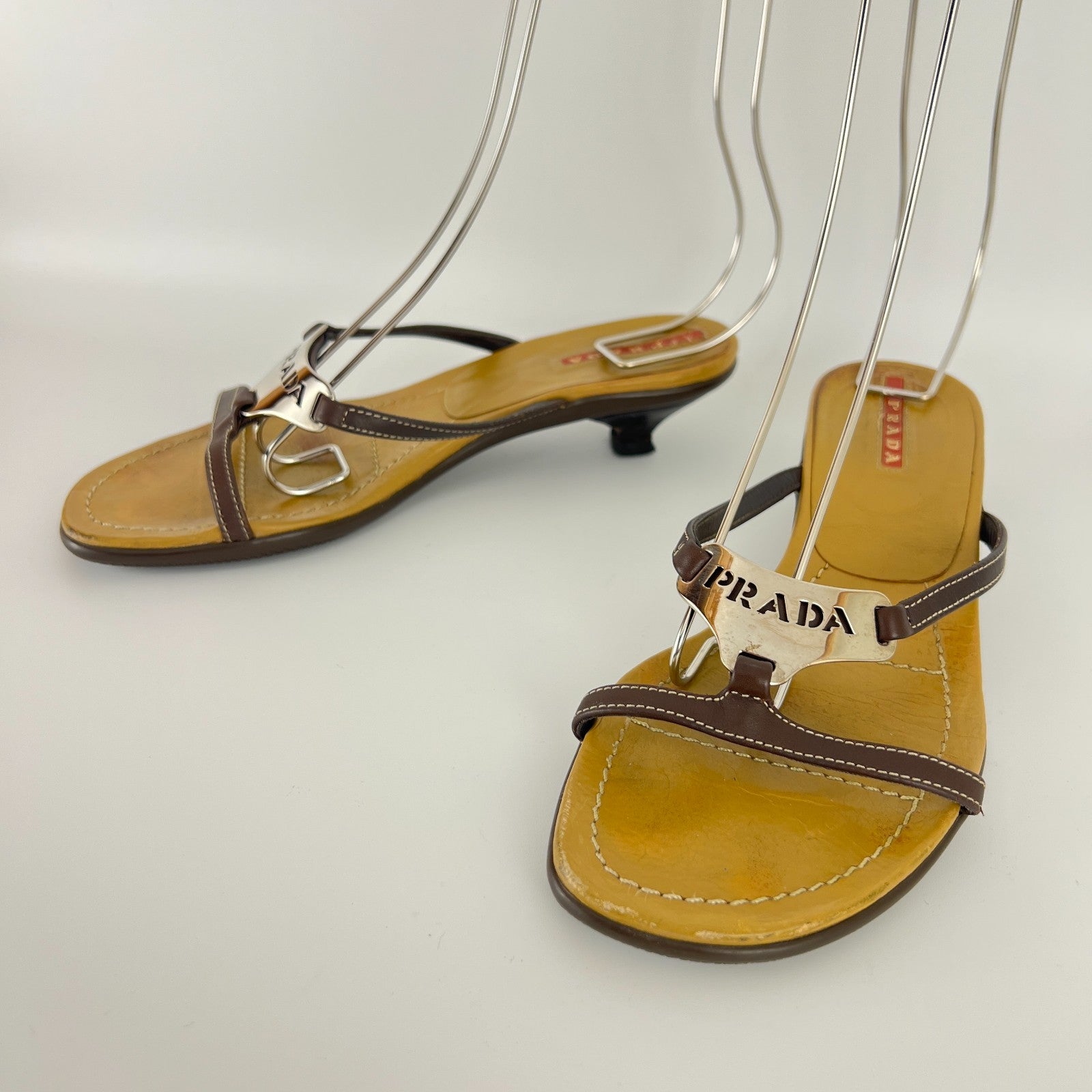 Prada | Auth Brown Leather Silver Logo Buckle Kitten Sandal Heels (34.5)