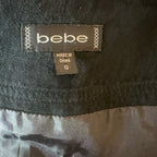 Vintage 00s Bebe black suede mini skirt with buckles & studs Y2K style