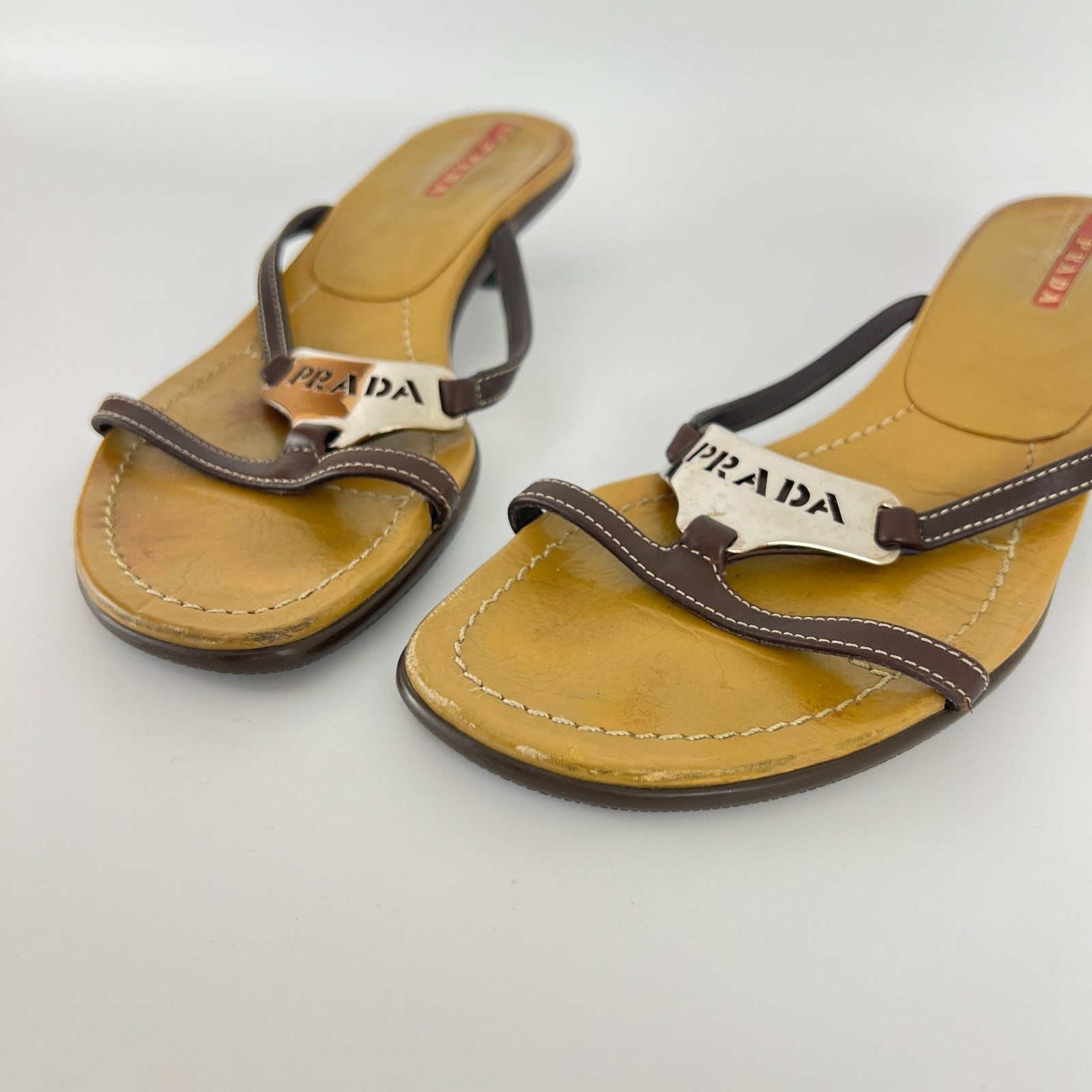 Prada | Auth Brown Leather Silver Logo Buckle Kitten Sandal Heels (34.5)